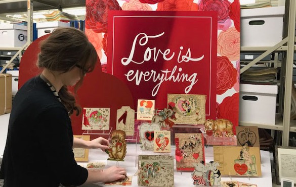 Bradbeer prepares a Valentine’s Day display for the nearby Hallmark Visitors Center. Hallmark has created millions of products since 1910, and the Hallmark Archives has stored and preserved a sampling from every year and holiday or occasion (Courtesy of Hallmark Cards, Inc.).